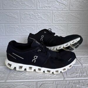 Black and White Athletic Shoes with Breathable Mesh and Cushioned Outsole